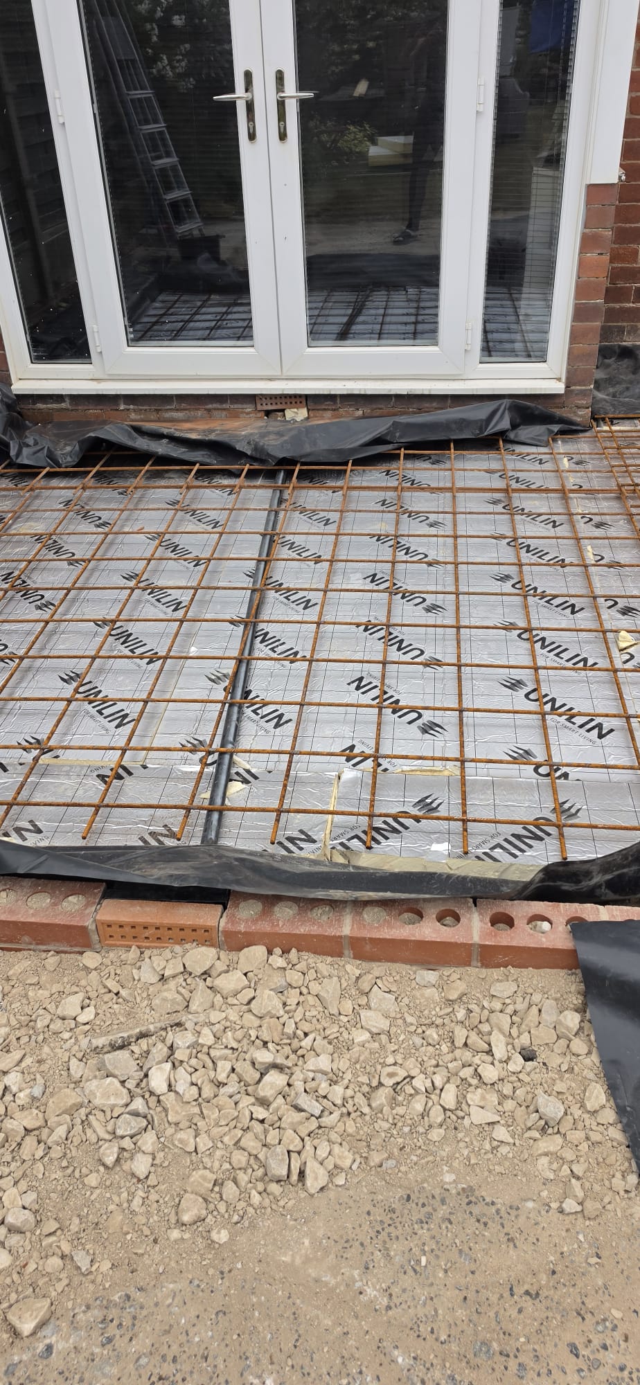 Steel rebar reinforcement grid over insulation ready for a concrete slab pour by DSG Groundworks, Blackpool