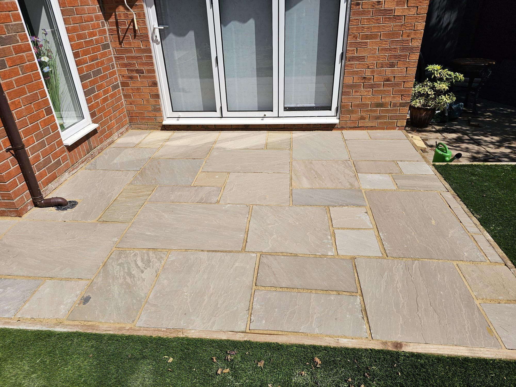 Indian stone patio installation in a private garden