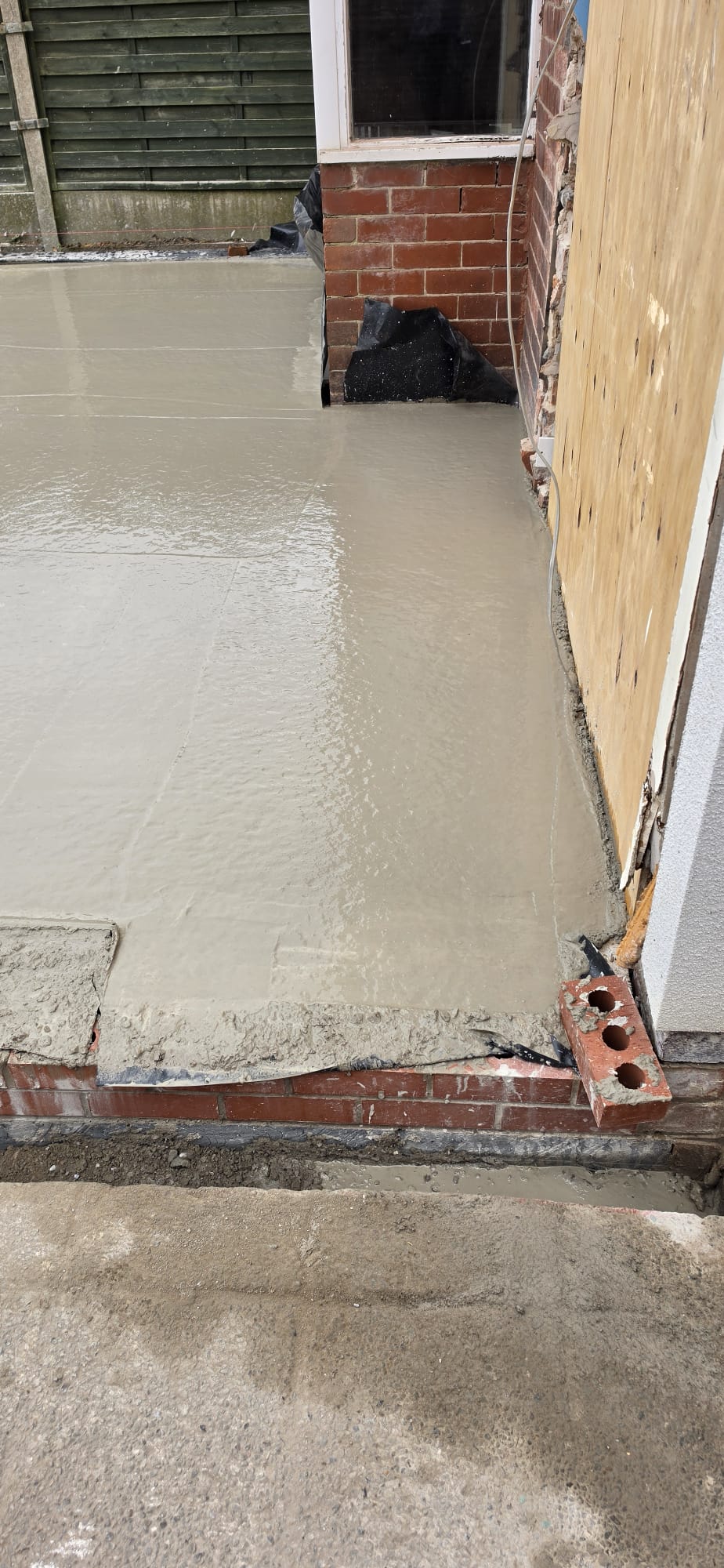 Finished concrete patio laid to the rear of a property by DSG Groundworks, Blackpool