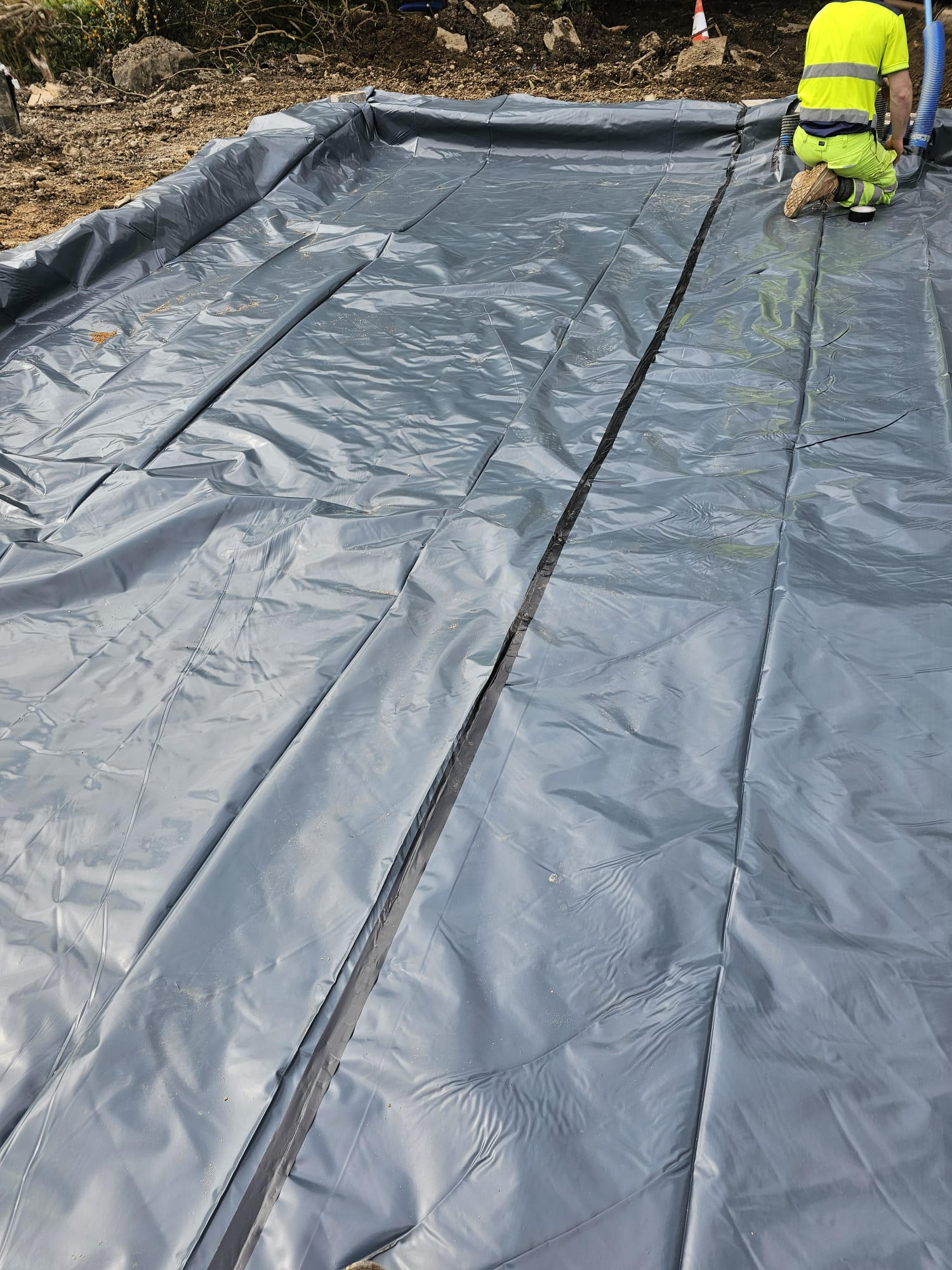 Taped DPM membrane laid over compacted base ready for slab